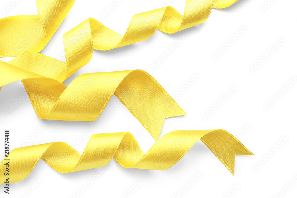Yellow satin ribbons on white background