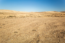 Panorama Of Far Desert Hills Under Blue Sky