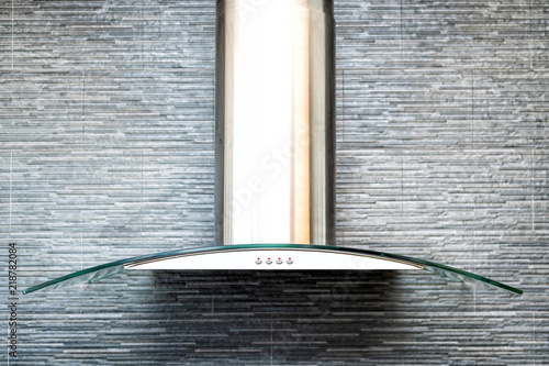 Closeup Of Modern Kitchen Exhaust Fan Above Electric Gas Stove Contemporary Stone Tiles Tiled Wall Finish Backsplash Buy This Stock Photo And Explore Similar Images At Adobe Stock Adobe Stock