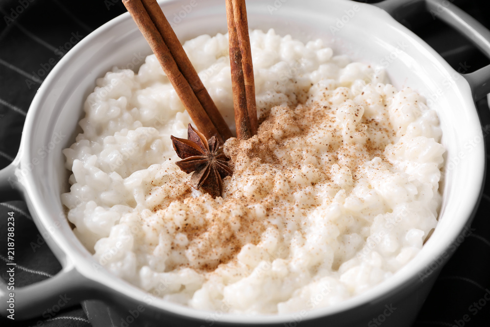 Delicious rice pudding with cinnamon and anise in casserole, closeup