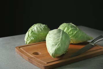 Fresh pointed cabbage on wooden board