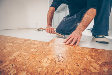 Wall Mural - Master picks a series of cork floor cork flooring with a hammer