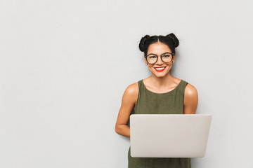 Wall Mural - Portrait of a positive young woman isolated