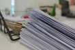 Document pile on office desk