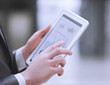 © yurolaitsalbert - close up.businessman working on a digital tablet with financial data