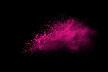 Abstract Pink Powder Explosion On Black Background. Abstract Colored Powder Splatted, Freeze Motion Of Pink Powder Exploding.