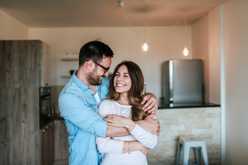 happy couple hugging.