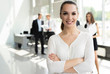 © opolja - Face of beautiful woman on the background of business people.