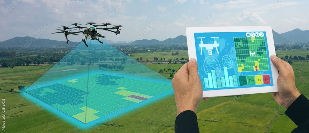 drone for agriculture, drone use for various fields like research analysis, safety,rescue, terrain scanning technology, monitoring soil hydration ,yield problem and send data to smart farmer on tablet - obrazy, fototapety, plakaty 