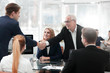 © ASDF - business partners shake hands in the conference room
