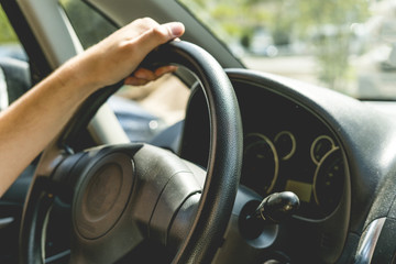 a close up man driving the car, cabin interior