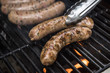 © Liz Clayman - Sausages cooking on a grill