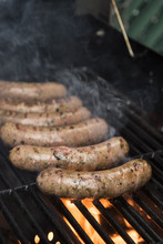 Sausages Cooking On A Grill