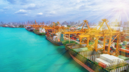 Ship and container from sea port for international import export or transportation concept with sunshine.