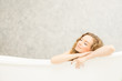 © pic for you - Young woman relaxing in bath.beautiful woman lying in bathtub.