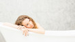 © pic for you - Young woman relaxing in bath.beautiful woman lying in bathtub.