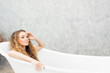 © pic for you - Young woman relaxing in bath.beautiful woman lying in bathtub.