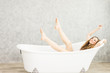 © pic for you - Young woman relaxing in bath.beautiful woman lying in bathtub.