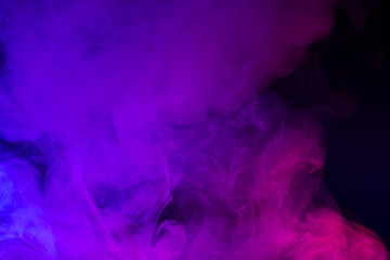 Colorful smoke close-up on a black background