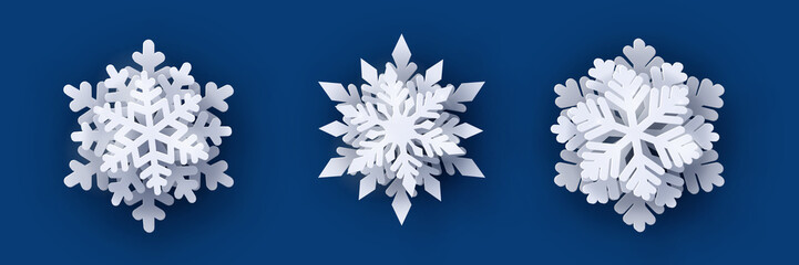 Wall Mural - vector set of 3 white christmas paper cut 3d snowflakes with shadow on dark blue background. new yea