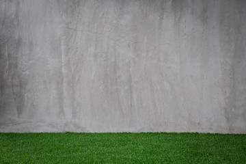 Wall Mural - Green grass artificial turf pattern with gray cement wall