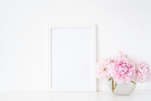 Minimal Feminine White Blank A4 Frame Mockup. Floral Bouquet Of Pink Peonies In Transparent Vase. Background, Mock Up For Quote, Promotion, Headline, Design, Lifestyle Bloggers And Social Media