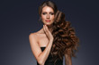© Utkamandarinka - Beautiful hair long curly hairstyle woman with beauty makeup female model portrait