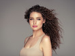© Utkamandarinka - Beautiful hair long curly hairstyle woman with beauty makeup female model portrait