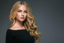 Blonde Hairstyle Woman Beauty With Long Curly Blonde Hair Over Dark Background