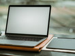 © Sevendeman - Empty screen laptop with camera and ice coffee in the cafe.
