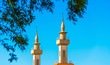 Minarets of the mosque against the sky, Buenos Aires, Argentina. Copy space for text. Isolated on blue background.