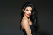 Black Hair Woman. Beautiful Brunette Hairstyle Fashion Portrait Over Dark Background