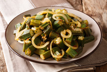 Vegan Cuisine: Spicy Okra Fried With Onion Close-up On A Plate. Horizontal