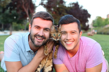 Cute gay couple with a bengal cat