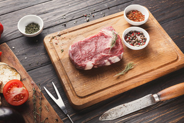 Canvas Print - Raw beef filet mignon steak on wooden board