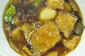 braised fish maw in red gravy on bowl