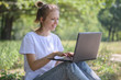 © olegkruglyak3 - Girl with a laptop outdoors
