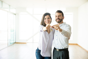 Loving Man And Woman Showing New House Keys