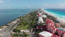 Aerial View Of Tropical Isthmus With Resorts And Beaches. Moving Across Cancun Peninsula With Resorts, Hotels And Beautiful View Of White Sand Beach In Mexico.Drone Shot Crossing Narrow Strip Of Land.