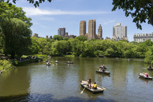 Tourists Enjoying A Lake In Central Park 
