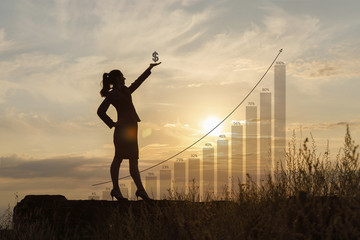 Businesswoman with dollar sign in hand .