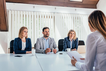 Poster - Woman having a job interview with HR specialists.