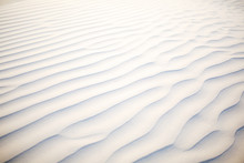 Waves On White Sand Background