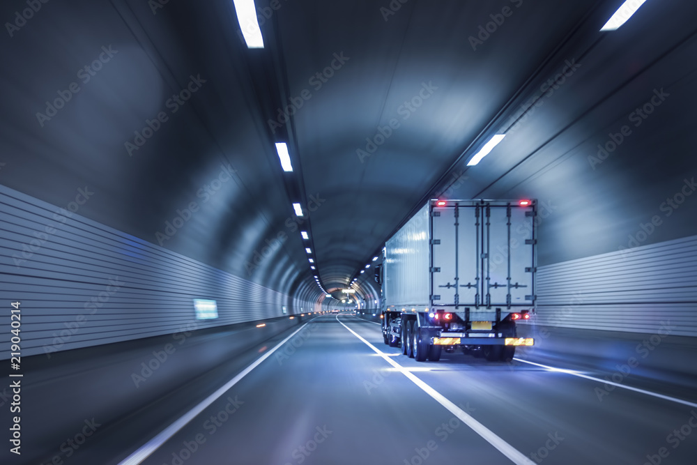 Truck passing through tunnels for safe and fast transport. - obrazy, fototapety, plakaty 