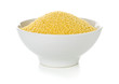 Heap of raw, uncooked couscous in white bowl over white