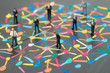 Diversify people or social network concept, miniature people businessmen standing on colorful pastel chalk line link and connect between multiple dot or peer on blackboard
