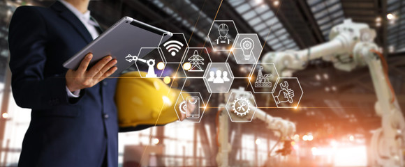 Fototapete - A futuristic architect, Businessman, Engineer manager using tablet with icon. Construction technology concept