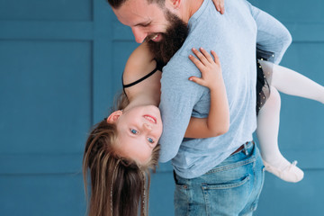 playful family leisure. father love expression. dad holding his little girl in his hands. cute child laughing. joy happiness and fun moments.