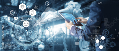 Fotomural Technician manager, Industrial engineer controlling roboticts on monitoring system software and icon industry network connection on tablet