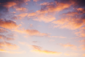 Beautiful bright sunset sky with pink clouds, natural abstract background and texture, heaven, religion